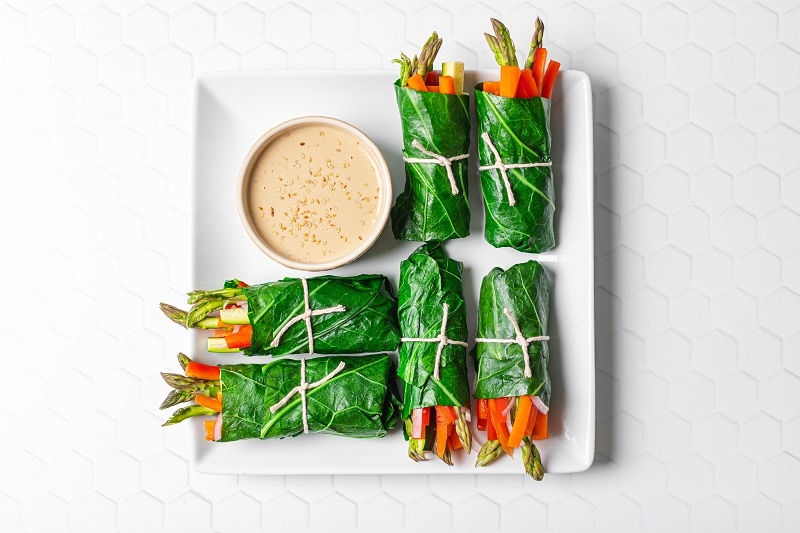 Homemade Collard Green Veggie Wraps on Plate with Tahini-Miso Dipping Sauce | Vitacost.com/Blog