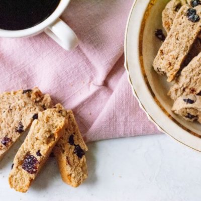 Cherry Almond Biscotti on Plate and Pink Napkin with Coffee | Vitacost.com/blog