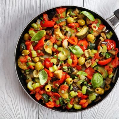 Eggplant Caponata in Skillet on White Wooden Table | Vitacost.com/blog