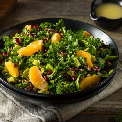 Kale Winter Salad With Orange Slices & Pomegranate in Black Salad Bowl | Vitacost.com/blog