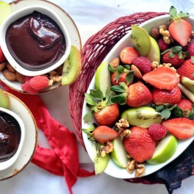 Chocolate Fondue in Ramekins on Table Next to Plate of Fruit and Nuts | Vitacost.com/blog