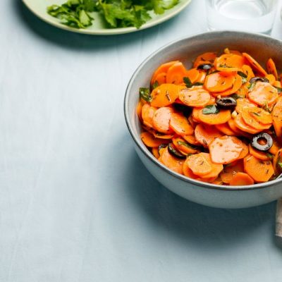 Moroccan Carrot Salad With Olives in Stoneware Bowl on Tabletop | Vitacost.com/blog