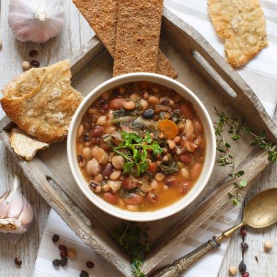 Veggie & Mushroom Stew in White Bowl on Wooden Tray with Bread | Vitacost.com/blog