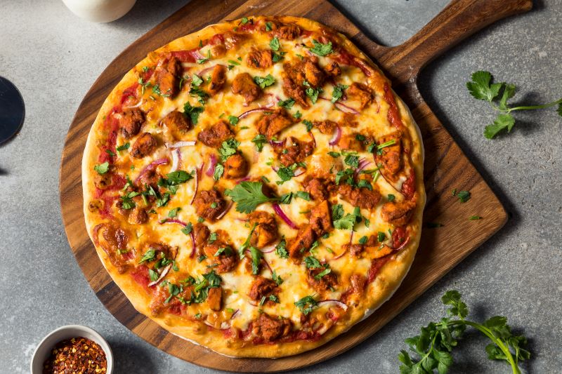 Thai Chicken Pizza on Wood Cutting Board on Gray Slate Counter | Vitacost.com/blog
