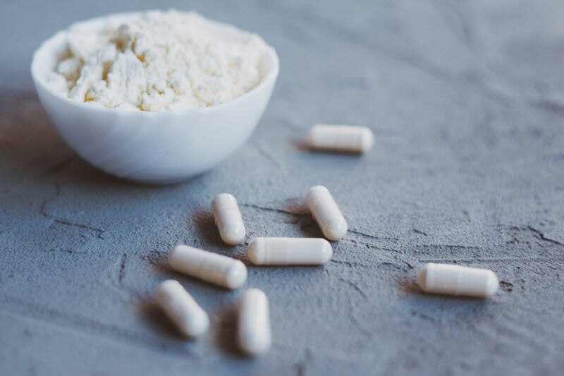 The Difference Between Marine and Bovine Collagen Peptides Represented by Collagen Capsules and Power on Gray Surface | Vitacost.com/blog