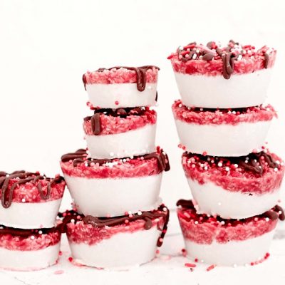 A Stack of Coconut Raspberry Bars With Chocolate Drizzle and Red and White Sprinkles | Vitacost.com/Blog