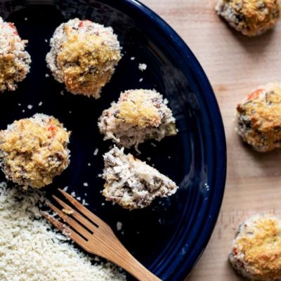 Baked Sauerkraut Balls with Beef & Peppers & Breadcrumb Coating on Blue Plate on Wooden Tabletop | Vitacost.com/blog