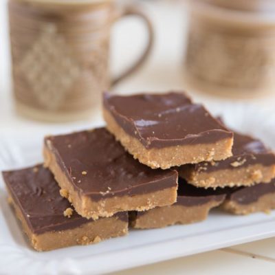Paleo Chocolate Sunflower Butter Protein Bars on Square Platter Next to Coffee Mugs | Vitacost.com/blog