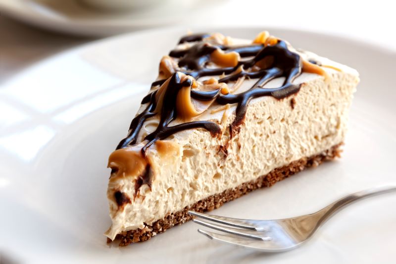 Vegan Salted Caramel & Chocolate Cheesecake on White Plate | Vitacost.com/blog