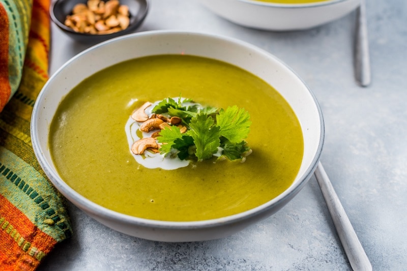 Homemade Creamy Greens Vegetable Soup in Bowl with Coconut Cream, Roasted Cashews & Cilantro | Vitacost.com/Blog