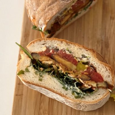 Homemade Vegan Roasted Eggplant Muffuletta Sandwich on Cutting Board | Vitacost.com/Blog