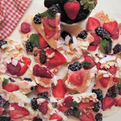 Frozen Yogurt Bark With Strawberries, Raspberries, Blackberries and Toasted Coconut Broken into Pieces on Plate | Vitacost.com/Blog