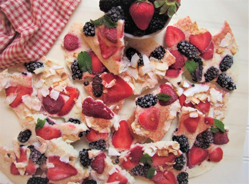 Frozen Yogurt Bark With Strawberries, Raspberries, Blackberries and Toasted Coconut Broken into Pieces on Plate | Vitacost.com/Blog