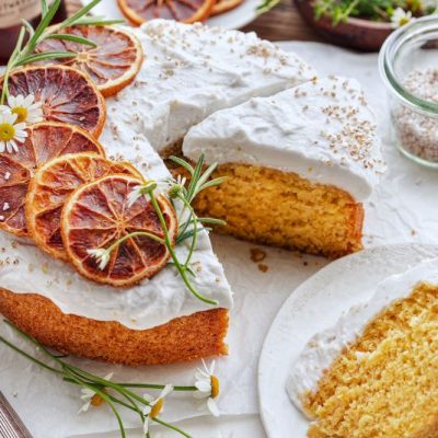 Orange Cake with Lemon-Coconut Whipped Cream on Cake Plate