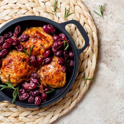 Pan-Roasted Chicken With Red Grapes & Rosemary on Woven Raffia Placemat | Vitacost.com/Blog