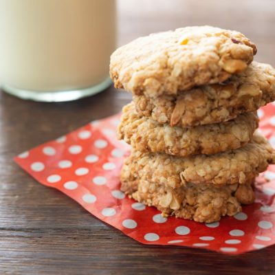 Soft-Baked Cashew Butter Cookies on Napkin with Glass of Milk