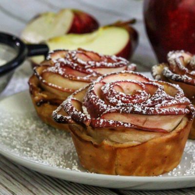 Cinnamon Apple Roses Dusted with Powdered Sugar and Placed on Serving Plate