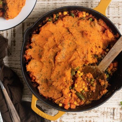 Vegan Shepherd's Pie with Sweet Potato in Cast Iron Skillet on Countertop