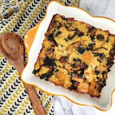 Mushroom & Kale Savory Bread Pudding in Ceramic Baking Dish