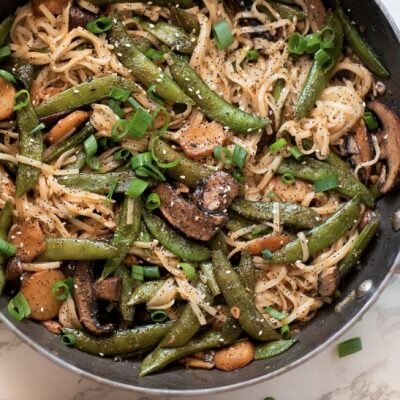Rice Noodle Bowl With Snap Peas, Mushroom & Water Chestnuts in Skillet