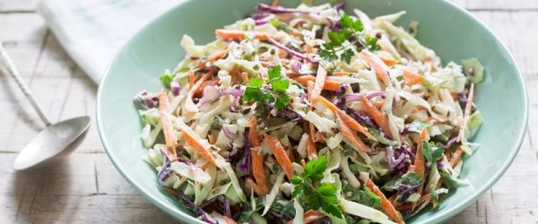 Keto Coleslaw in Green Bowl on White Wooden Tabletop