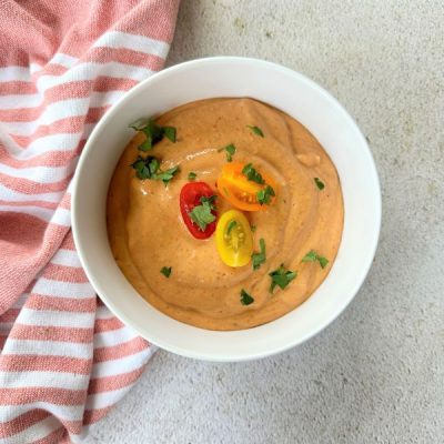 Creamy-looking Sheet Pan Roasted Tomato Soup in Bowl on Counter