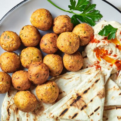 Falafel Balls on a Plate with Pita Bread and Hummus