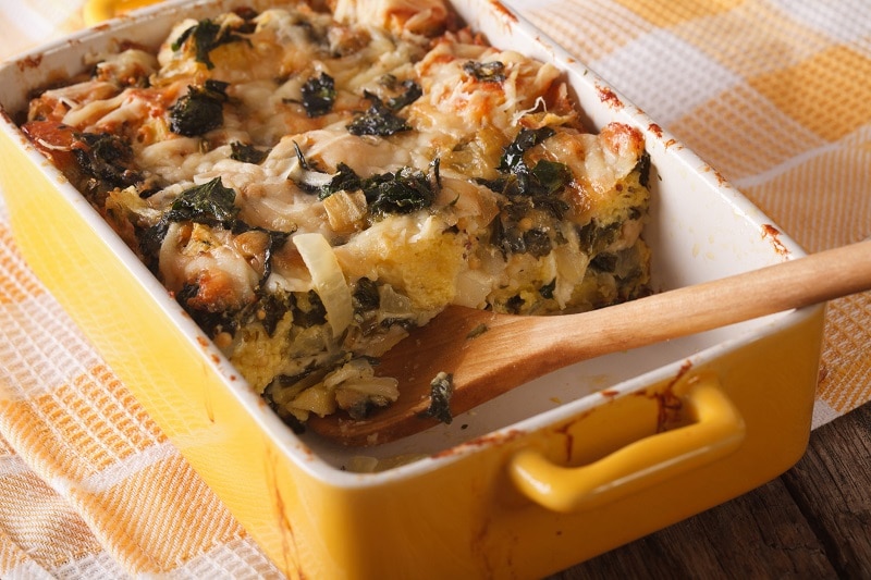 A Yellow Casserole Dish Holds a Gluten-Free Breakfast Casserole of Eggs, Spinach, Mushrooms, Butternut Squash and Gluten-Free Bread.