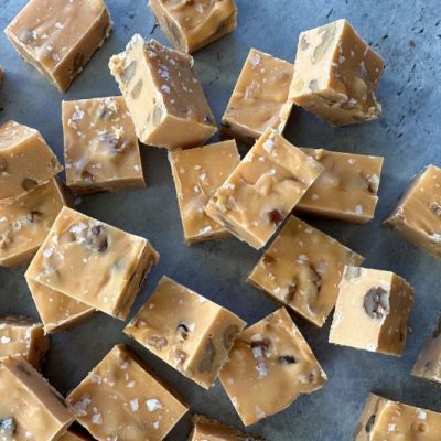 An Overhead Shot Shows Cubes of Caramel-Colored Fudge With Sprinkles of Salt.