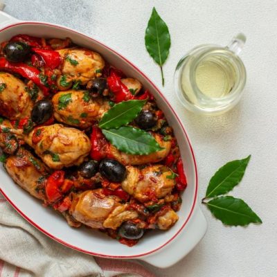 Simple Chicken Cacciatore Recipe in French Oven Pot on White Counter
