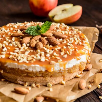 Caramel Apple Poke Cake Recipe with Whipped Cream and Caramel and Toffee on Top