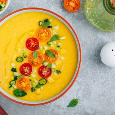Gazpacho Soup With Golden Beet & Carrot in Red-Rimmed Bowl