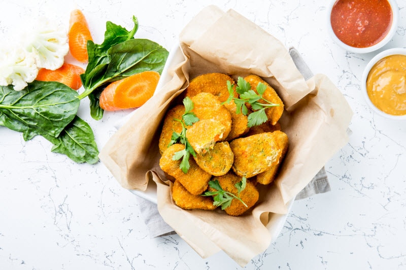 Plant Based Chicken Alternatives in Serving Tray With Veggies and Dipping Sauces