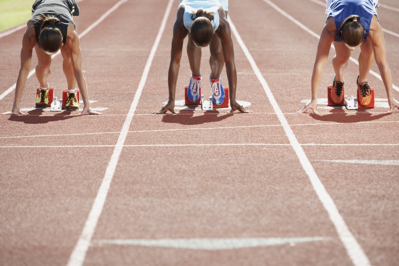 Concept of What is NSF Certified for Sport Represented by Athlete Runners Taking Position on Track to Start Race