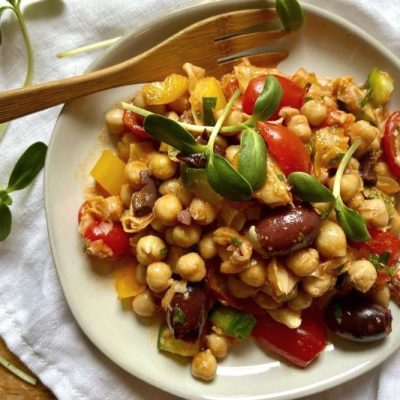 Mediterranean Chickpea Salad with Roasted Sweet Pepper Dressing on White Plate Set on White Linen Napkin