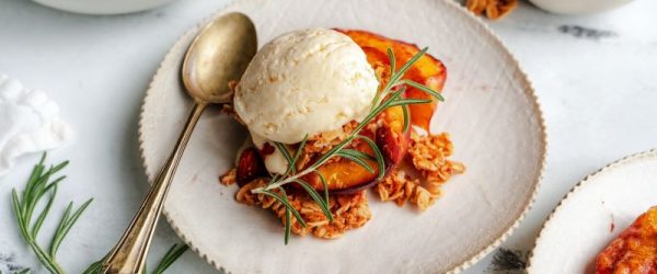 Nectarine Crumble on Fancy Plate with Vintage Silver Spoon on Marble Countertop