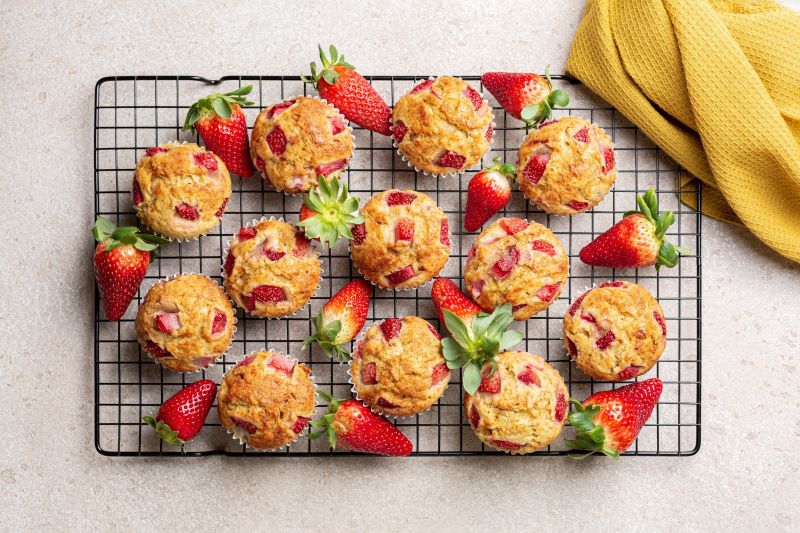 Strawberry Banana Muffins Cooling on Metal Rack