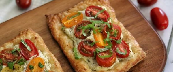Puff Pastry Tomato Tart on Serving Board Atop White Table