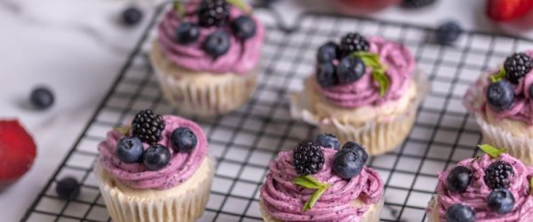 Vanilla Plum Vegan Gluten-Free Cupcakes Topped With Berries on Cooling Rack T