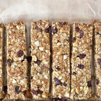 No-Bake Gluten-Free Granola Bars with Cranberries and Chocolate Chips on Parchment Paper