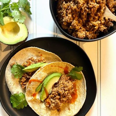 Vegan Tacos With Walnut-Cauliflower-Mushroom Filling on Black Plate