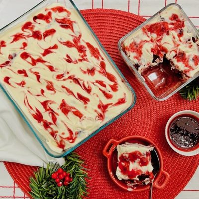 A Christmas-Themed Table is Set With Cranberry Tiramisu.