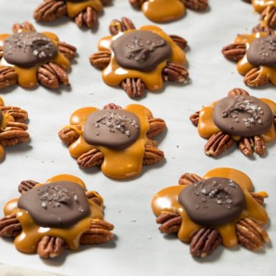 Closeup of Homemade Turtles Candy on Parchment Paper