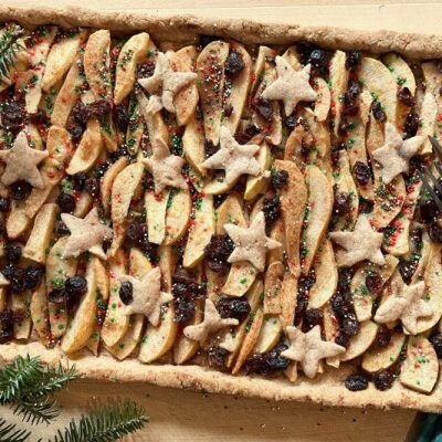 Slab Pie With Baked Pear Slices and Dried Cranberries Within a Golden Crust and Dappled With Cut-Out Star Shapes of Dough, all Sprinkled With Festive Sugar Sprinkles