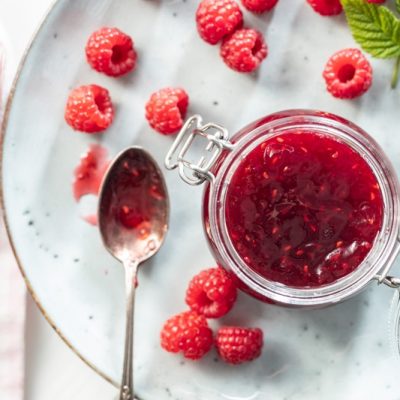 A Jar is Filled With Raspberry Chia Jam.