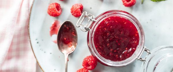 A Jar is Filled With Raspberry Chia Jam.