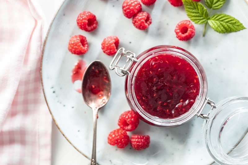 A Jar is Filled With Raspberry Chia Jam.