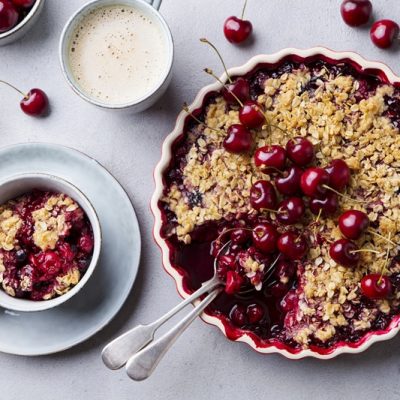A Gluten-Free Cherry Crisp Has a Handful of Fresh Cherries on Top.