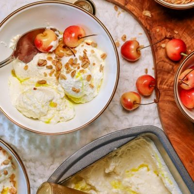 Olive Oil Ice Cream Topped With Fresh Cherries and Granola