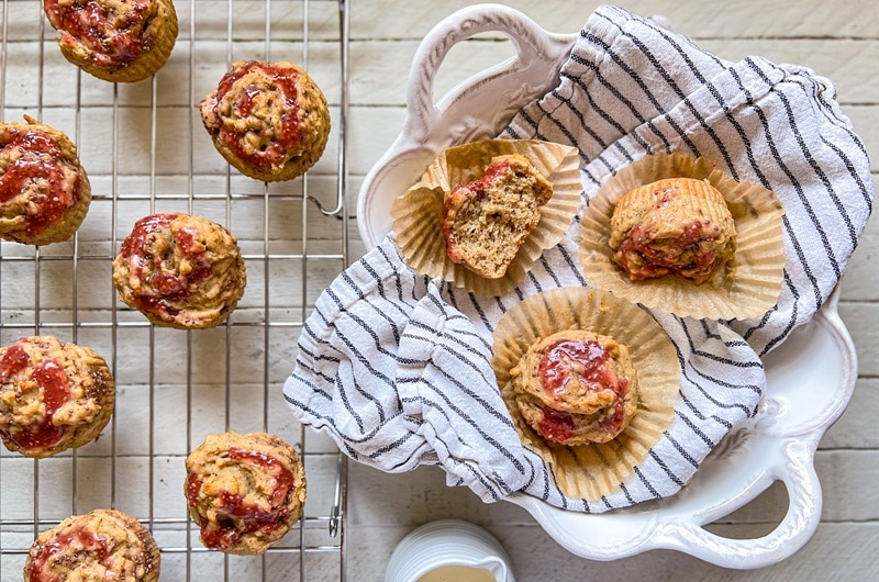 An Overhead View Shows Peanut Butter Muffins With Swirls of Chia Jam.